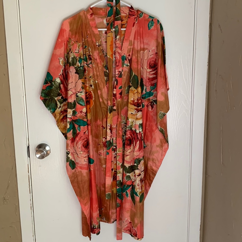 Pink floral pullover robe with tie in mid section. Never worn.